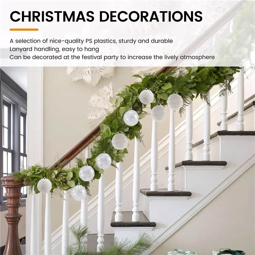 White shatterproof Christmas baubles with textured surface hanging on a green garland over a staircase railing