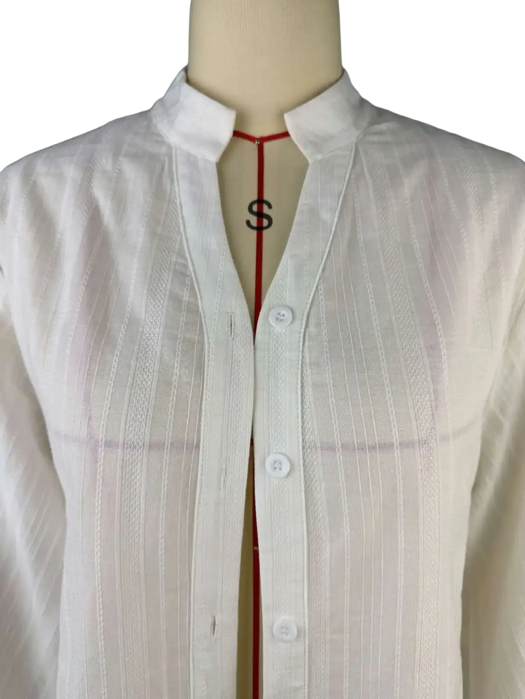 White cotton puff sleeve oversize blouse with subtle vertical ribbed texture and a crisp collar