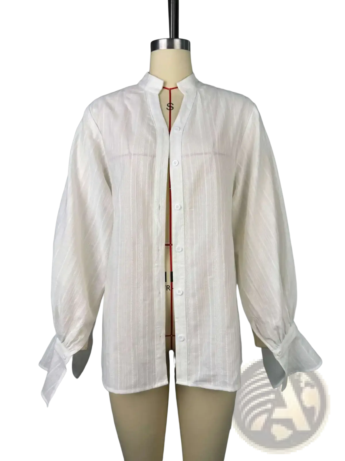 White cotton oversize blouse with puff sleeves and subtle vertical stripes featuring a mandarin collar