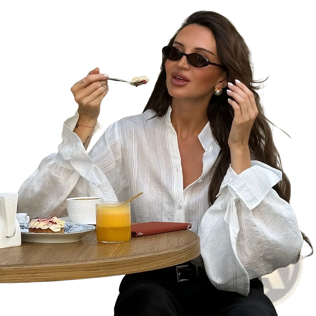 White cotton oversize blouse with voluminous puff sleeves and button-down front for elegant casual wear