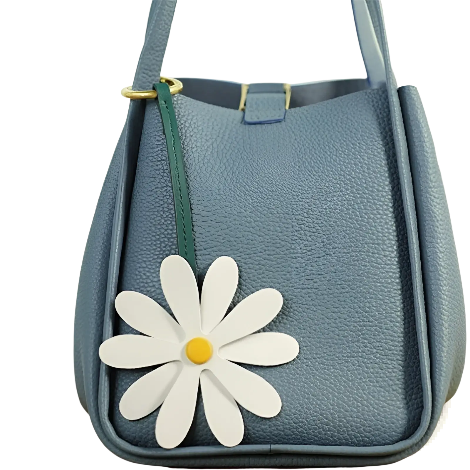 A light blue textured leather bucket bag with a white daisy leather bag charm keychain pendant