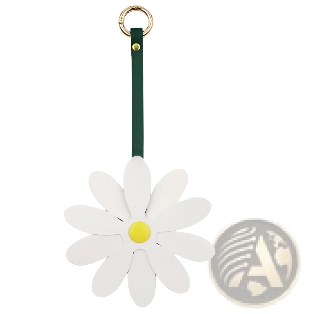 White daisy leather bag charm keychain pendant with yellow center and dark green leather strap