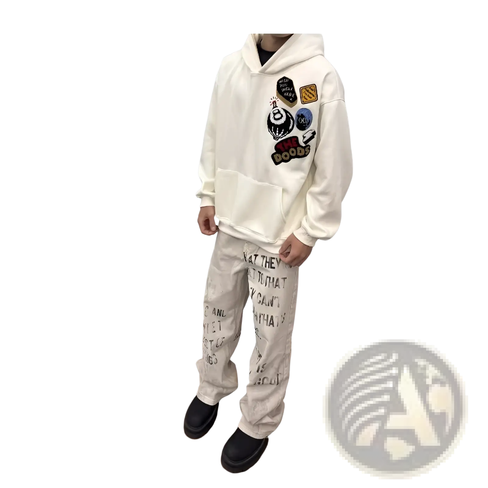 Cream-colored hoodie with front pocket and colorful patches paired with Off White distressed graffiti print cargo jeans