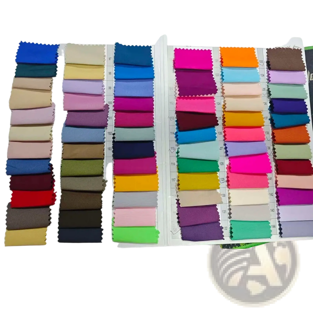 A vibrant collection of fabric swatches showcasing colors and textures for a white double breasted women pant suit