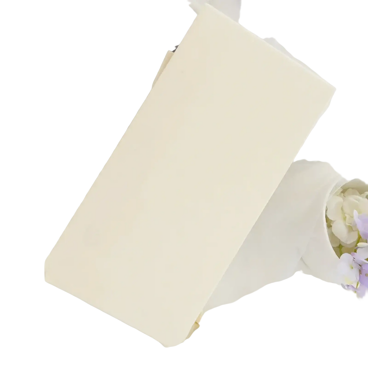 Cream white rectangular notebook with smooth matte finish displayed alongside white fleece lined thermal leggings for women