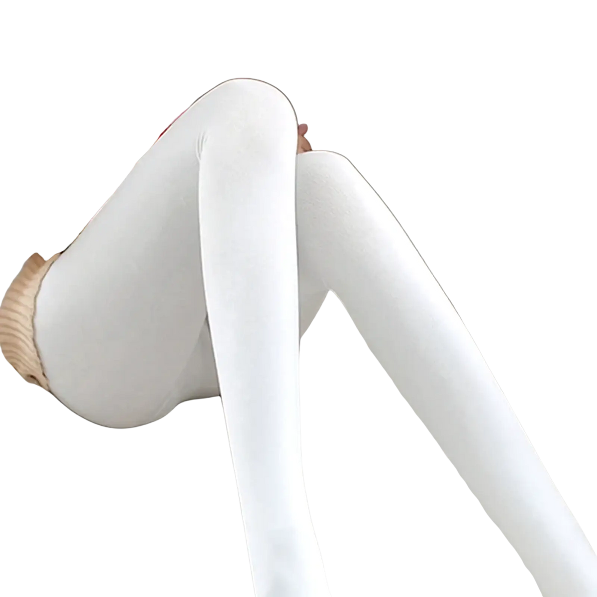 A person seated on a couch wearing white fleece lined thermal leggings with a smooth texture for women