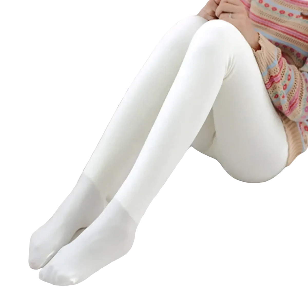 White fleece lined thermal leggings for women with smooth texture worn by a person seated with legs crossed