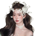 A delicate white floral wedding hair crown handmade with intricate lace and small blossoms for bridal wear