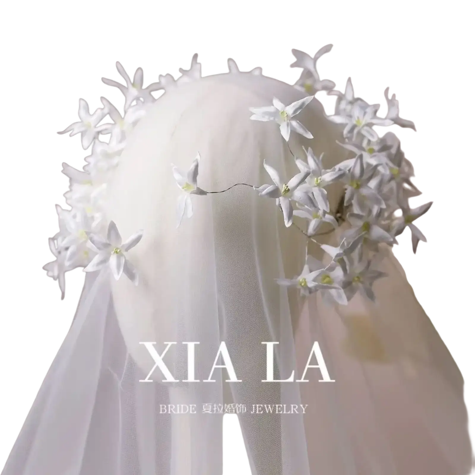 Elegant white floral wedding hair crown featuring delicate handcrafted blossoms and fine wire detailing for brides