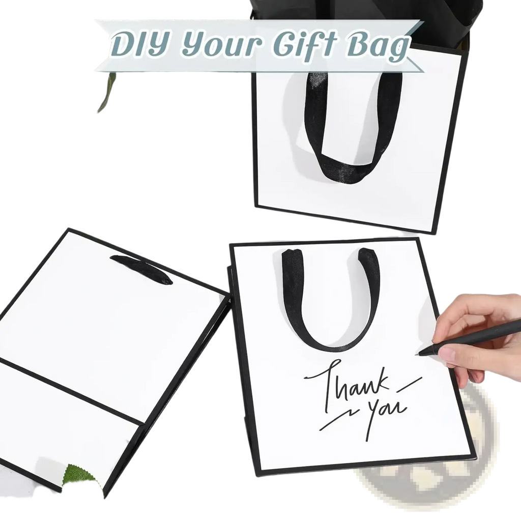 White gift bag with black ribbon handles featuring thank you inscription in elegant cursive script