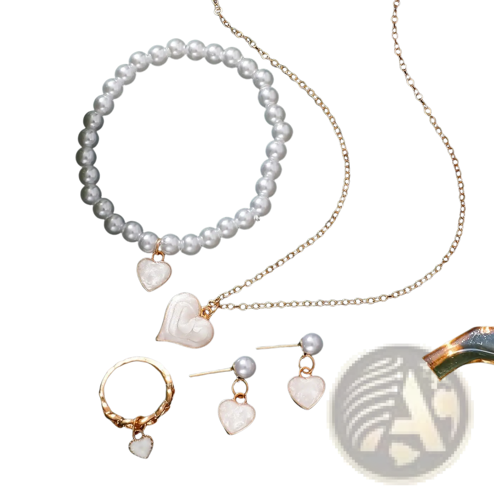 A gold-toned necklace from the white heart and pearl jewelry set featuring white pearls and a mother-of-pearl heart pendant