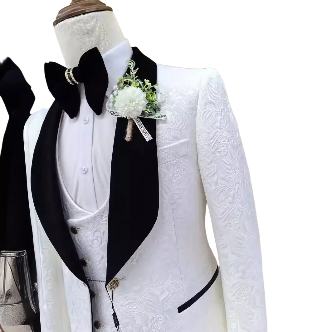 White jacquard tuxedo suit for men with black satin lapels and matching vest featuring embossed floral patterns