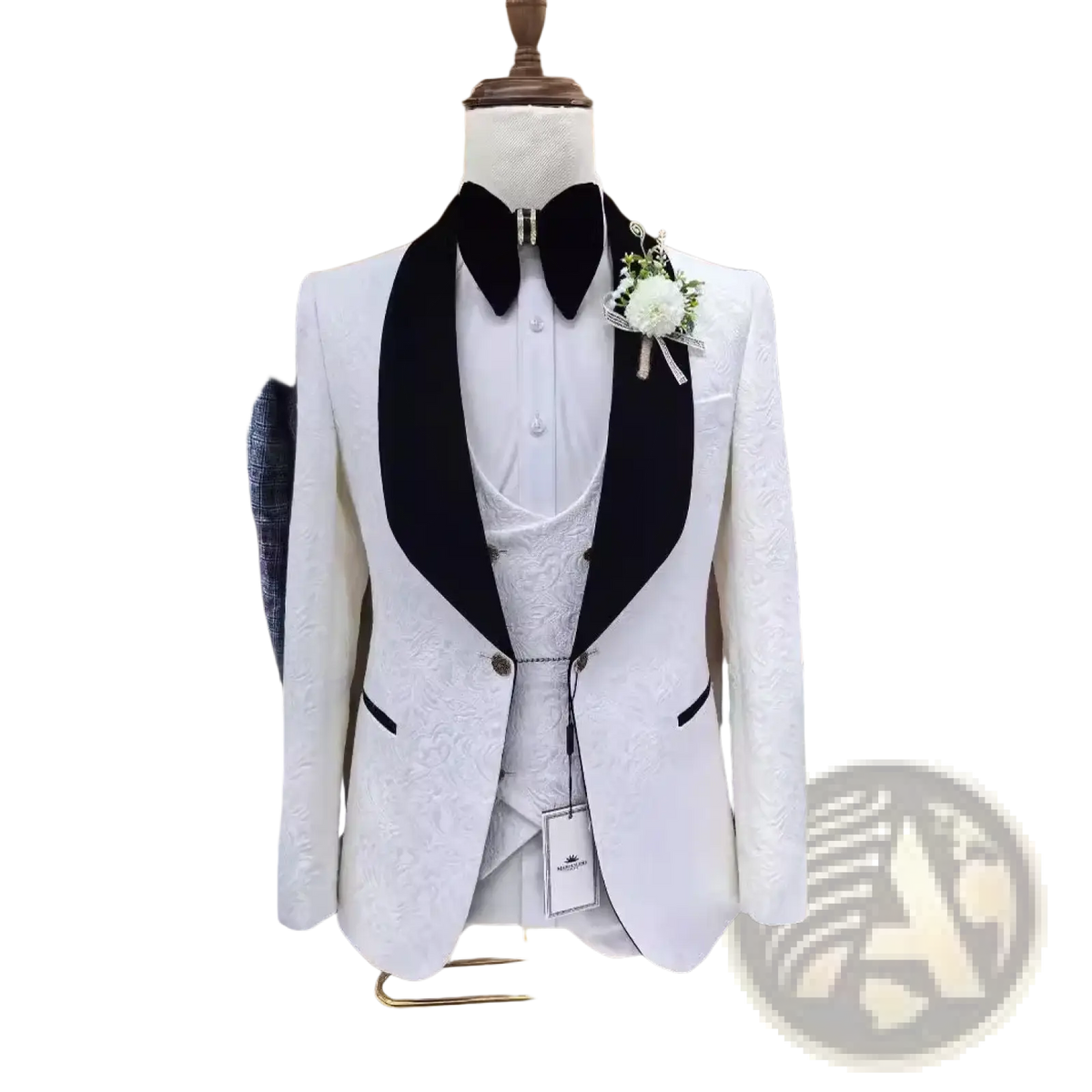 White jacquard tuxedo suit for men with black satin lapels and subtle textured fabric displayed on a mannequin