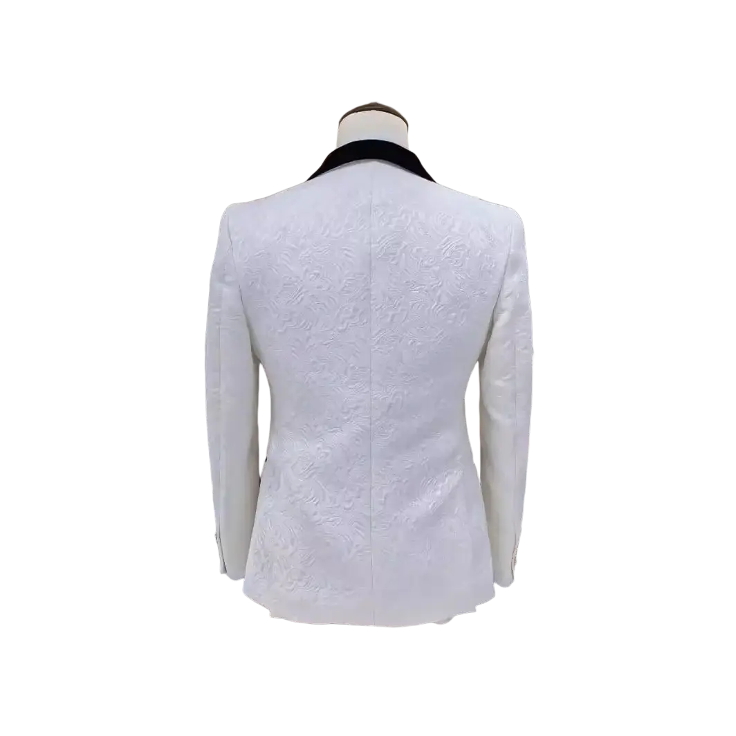 White jacquard tuxedo suit for men featuring a white textured blazer with a black velvet collar