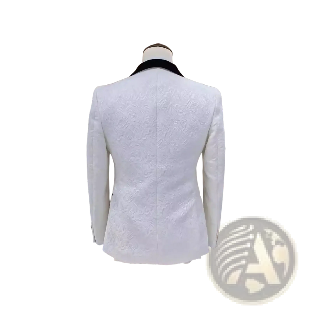White jacquard tuxedo suit for men featuring a white textured blazer with a black velvet collar