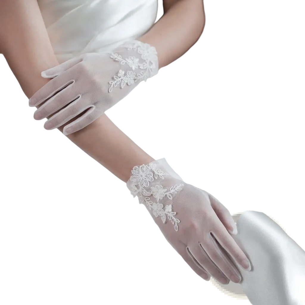 White lace bridal gloves featuring delicate floral embroidery on sheer tulle applique short design