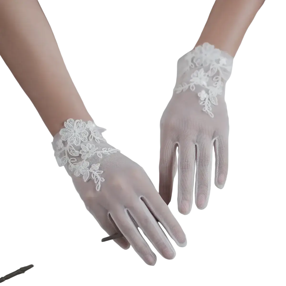 Delicate white lace bridal gloves featuring floral embroidery and sheer tulle applique for short wedding use