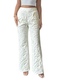 White lace high waisted wide leg pants featuring intricate lace pattern and wide leg design in white color