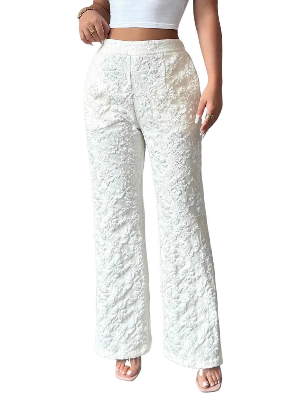 White lace high waisted wide leg pants featuring an intricate floral pattern in white lace fabric
