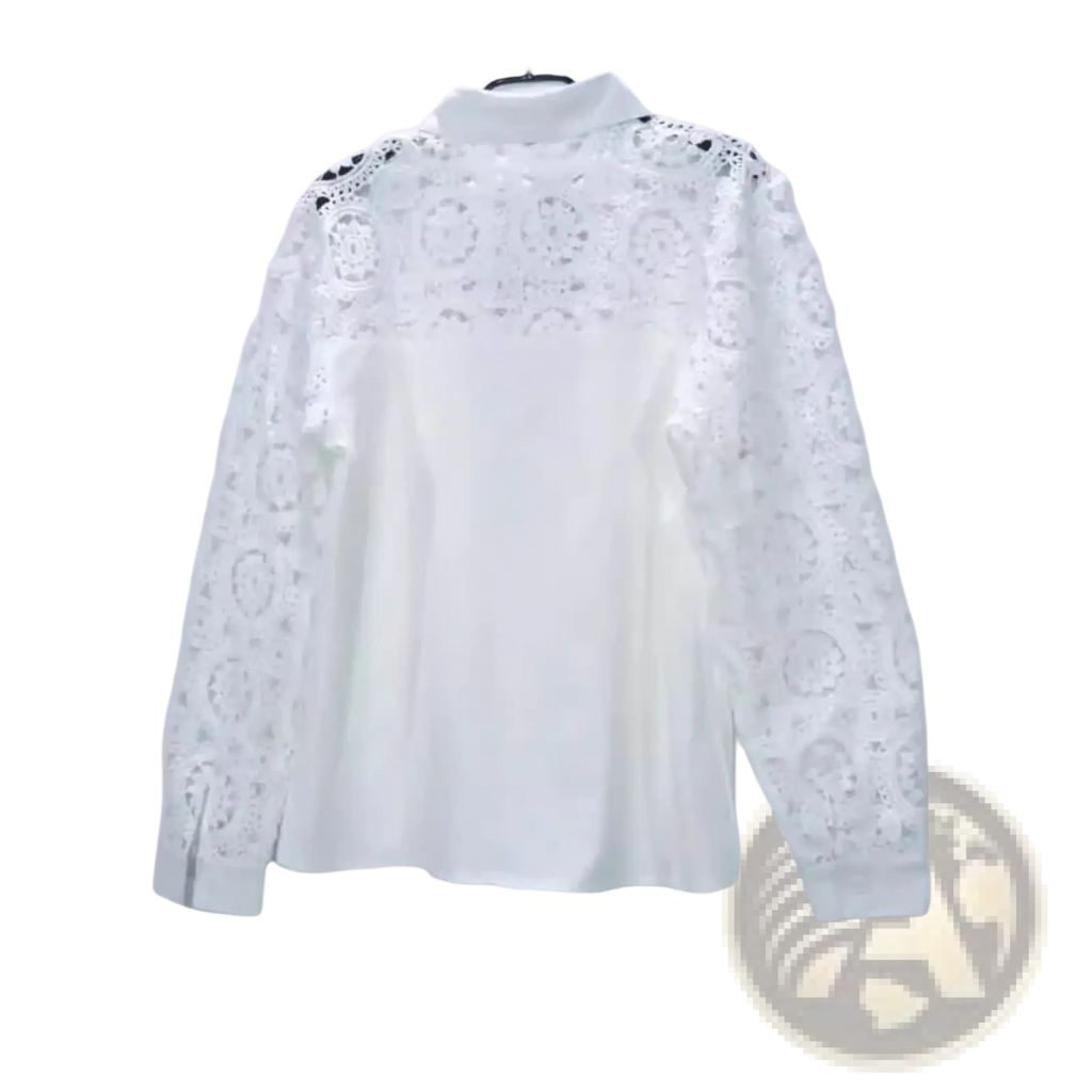 White lace office blouse with intricate floral lace patterns on shoulders and sleeves and a solid white body