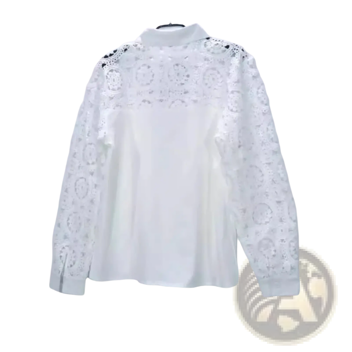 White lace office blouse with intricate floral lace patterns on shoulders and sleeves and a solid white body