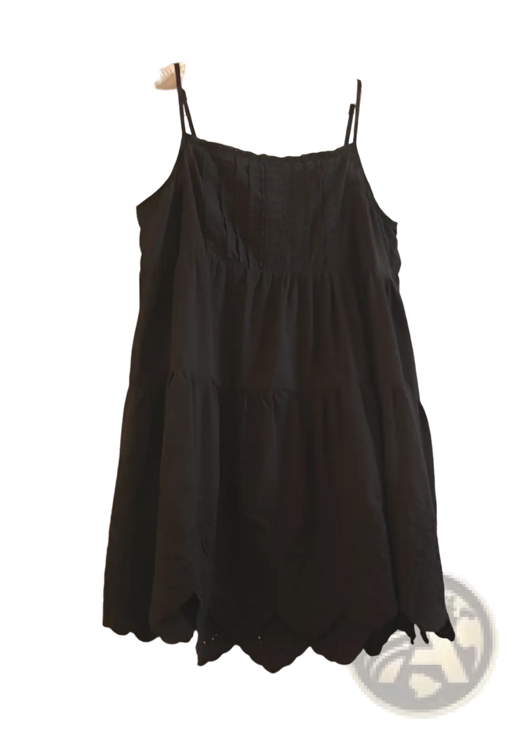Black eyelet lace tiered dress with thin spaghetti straps and scalloped hem in elegant sundress style