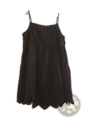Black eyelet lace tiered dress with thin spaghetti straps and scalloped hem in elegant sundress style