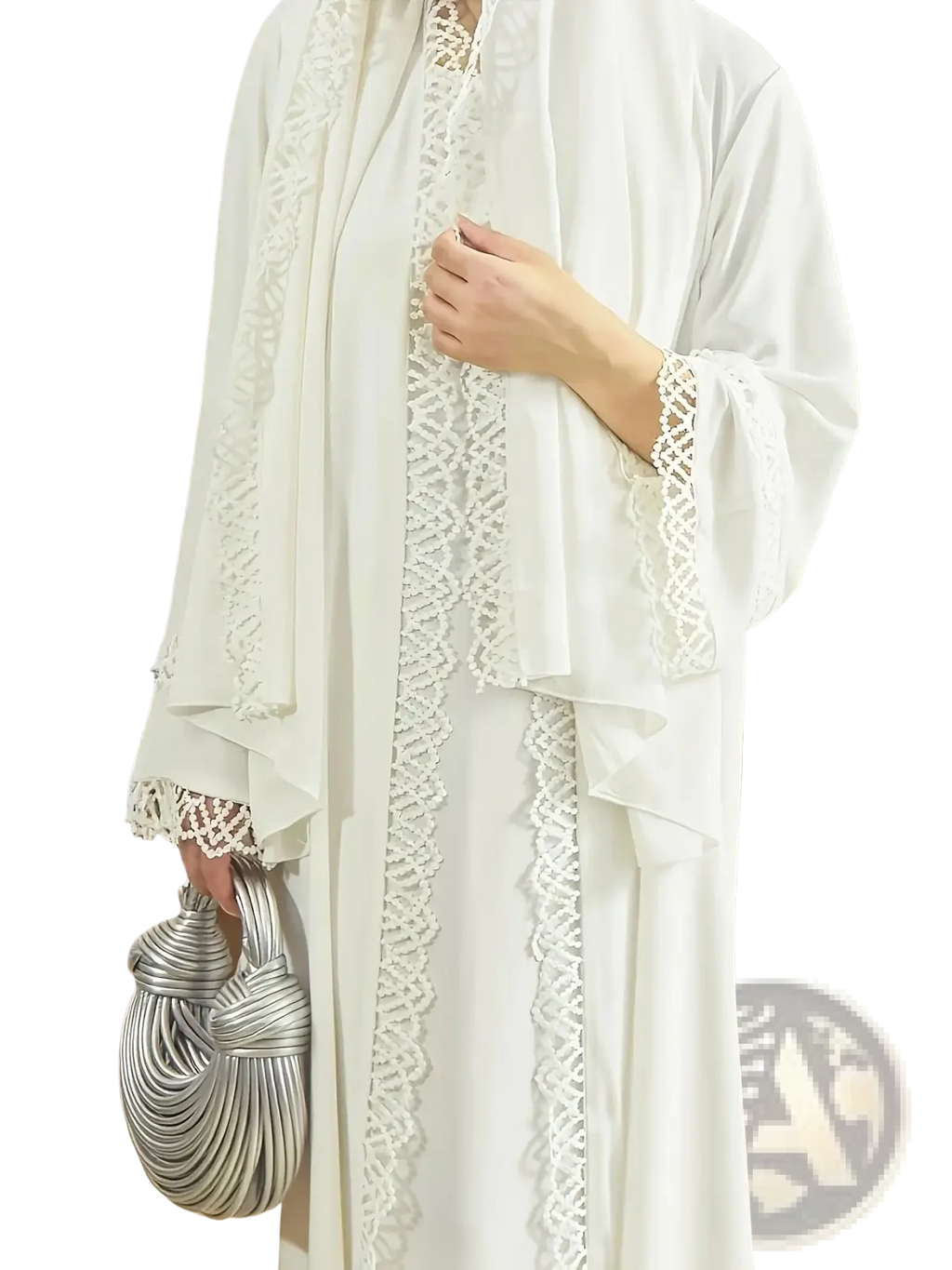 Silver twisted rope handbag placed with white lace trim abaya cardigan highlighting elegant accessory details