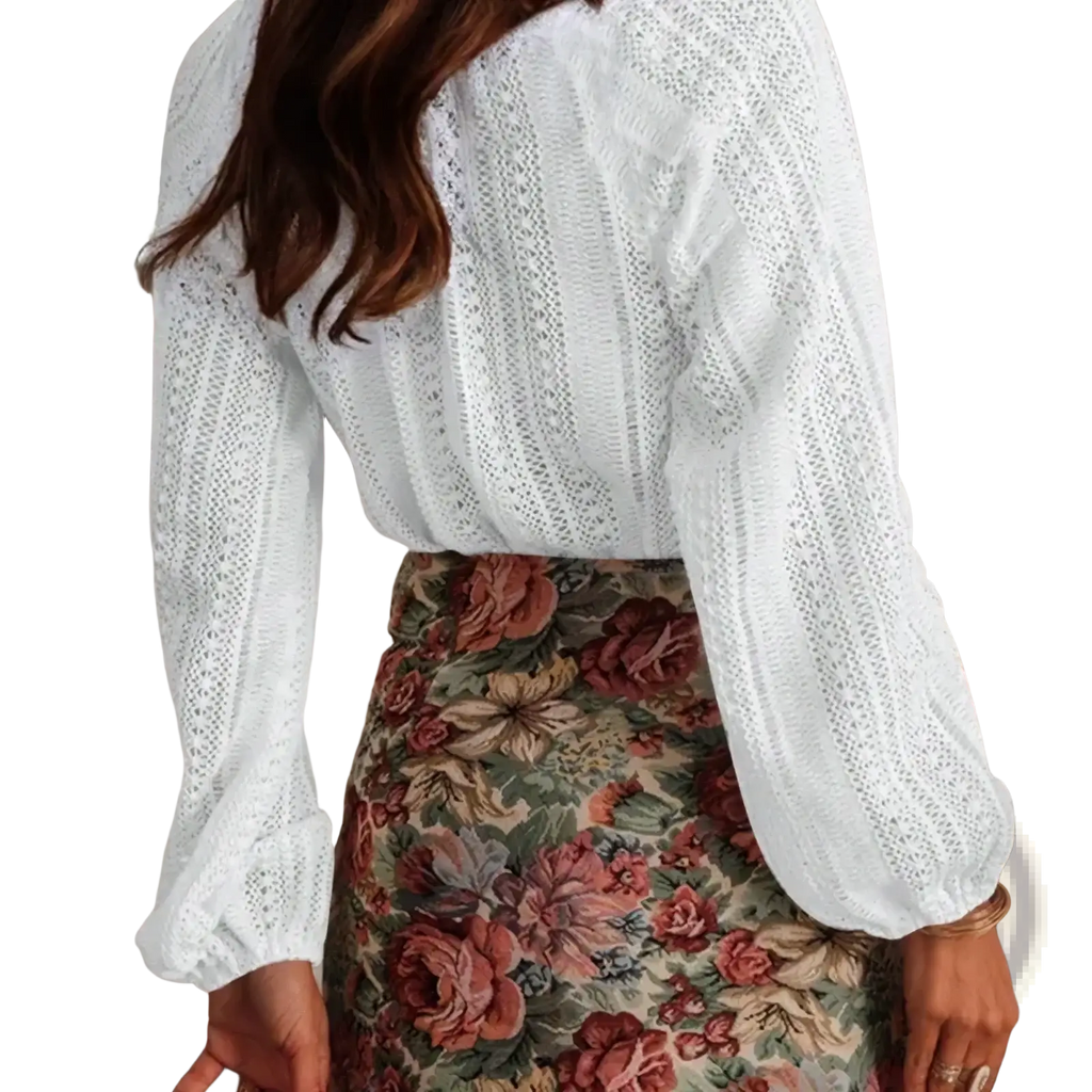 White lace v-neck long sleeve blouse with fitted waist and puffed sleeves in white lace fabric