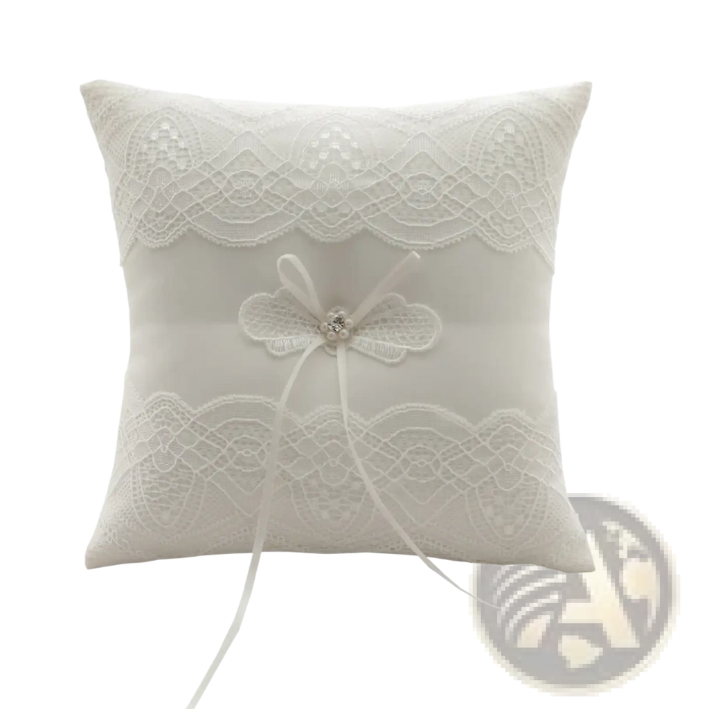 White lace wedding ring pillow with ivory lace, central bow, crystal embellishment, and ribbon bearer cushion