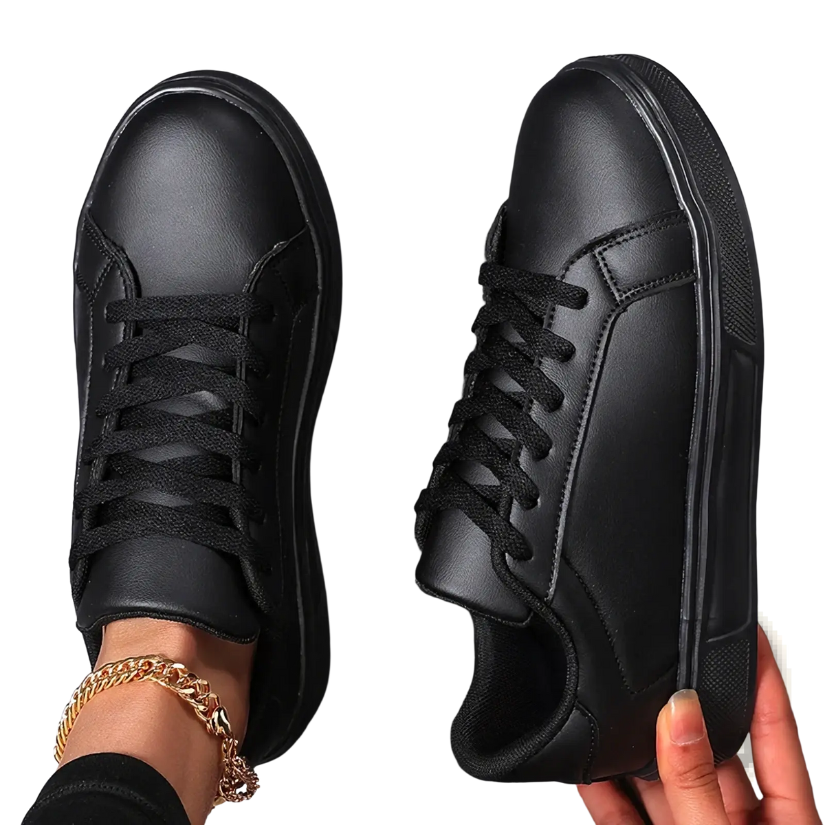 Black leather casual sneakers with thick soles and matching laces for lightweight sports use