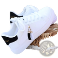 White leather tassel sneakers with platform soles breathable sports shoes featuring black heel tabs and gold lettering
