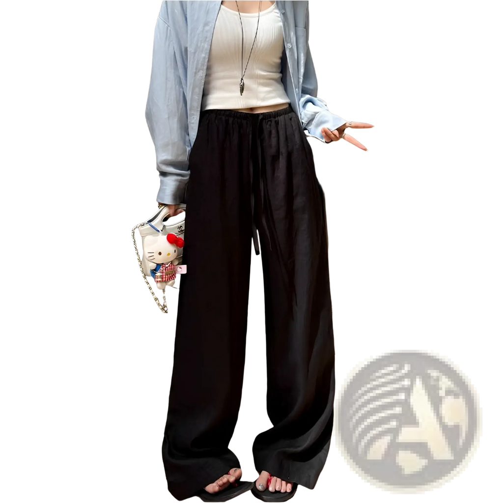 Black wide-leg pants in relaxed flowing fabric with a drawstring waistband suitable for casual wear