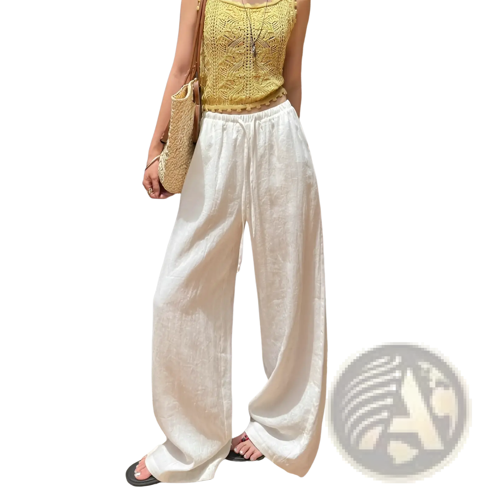 White linen wide leg pants with a relaxed flowing silhouette and an elastic waistband for comfort and style