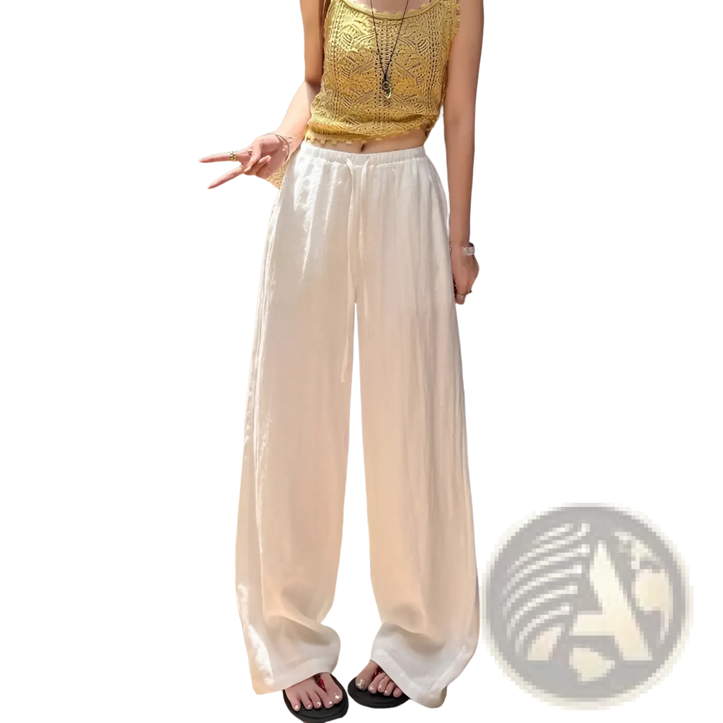 White linen wide leg pants featuring an elastic waistband for comfortable and stylish wear