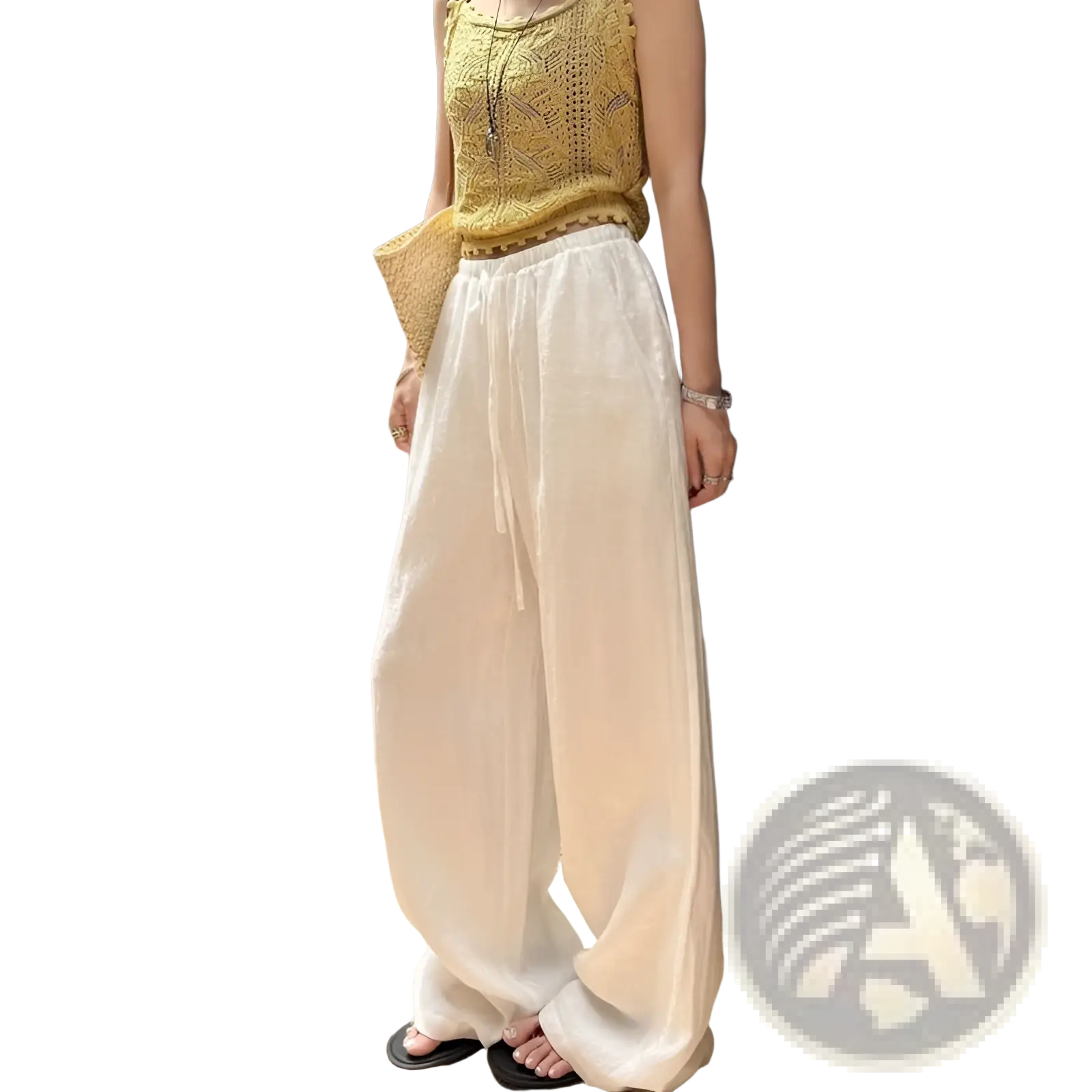 White linen wide leg pants featuring a drawstring waistband and breathable fabric for comfortable casual wear