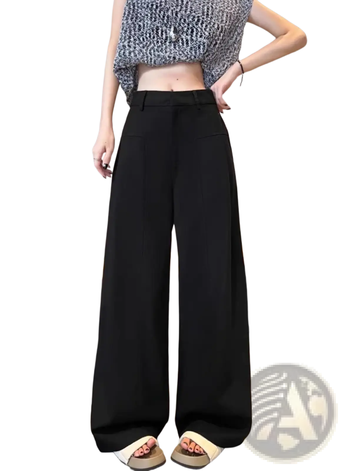 Black high-waisted wide-leg trousers with a sleek tailored fit shown from the back in contrast to white linen styling