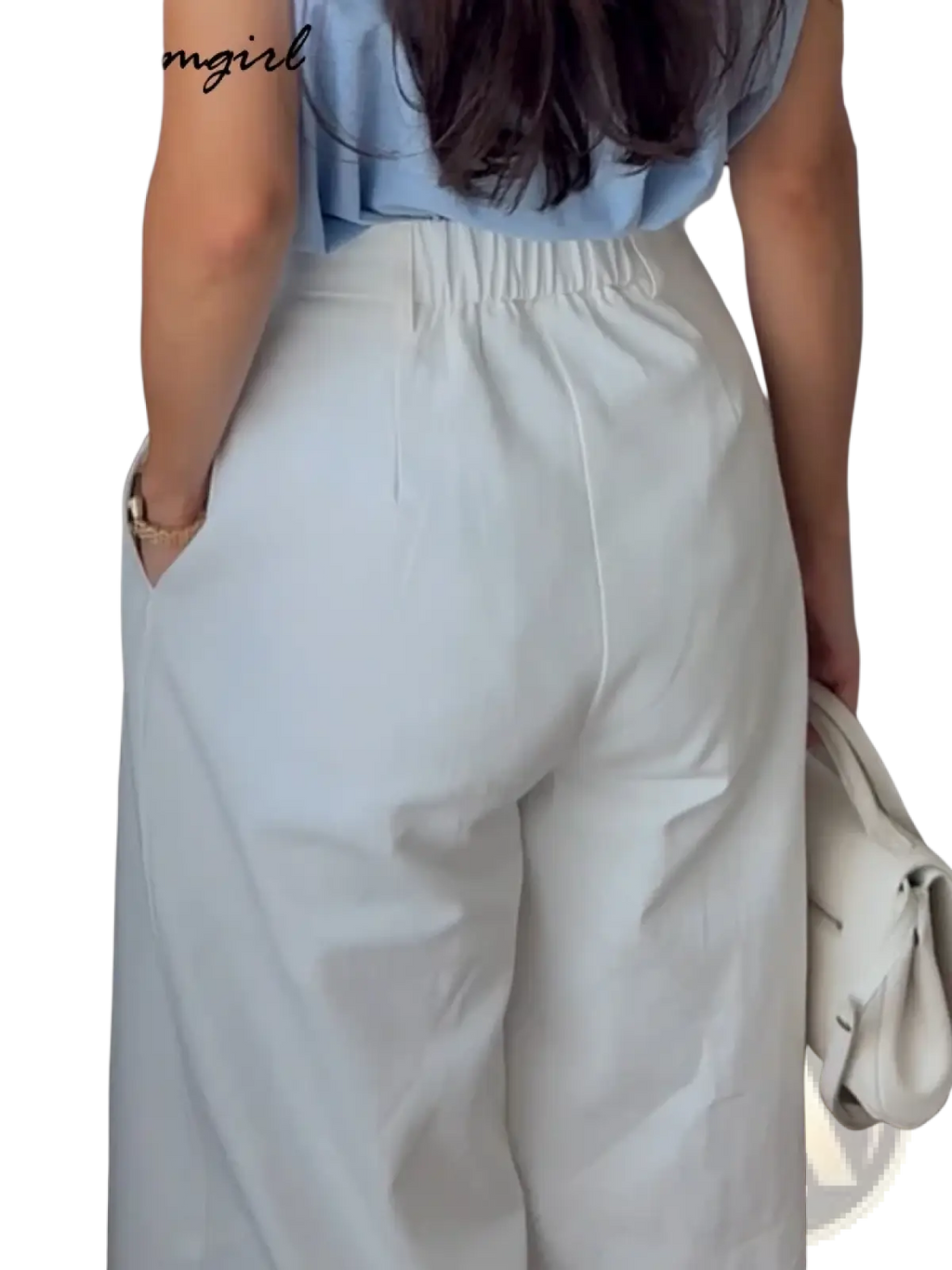 White linen wide leg trousers featuring high waist and elastic waistband for comfortable stylish wear