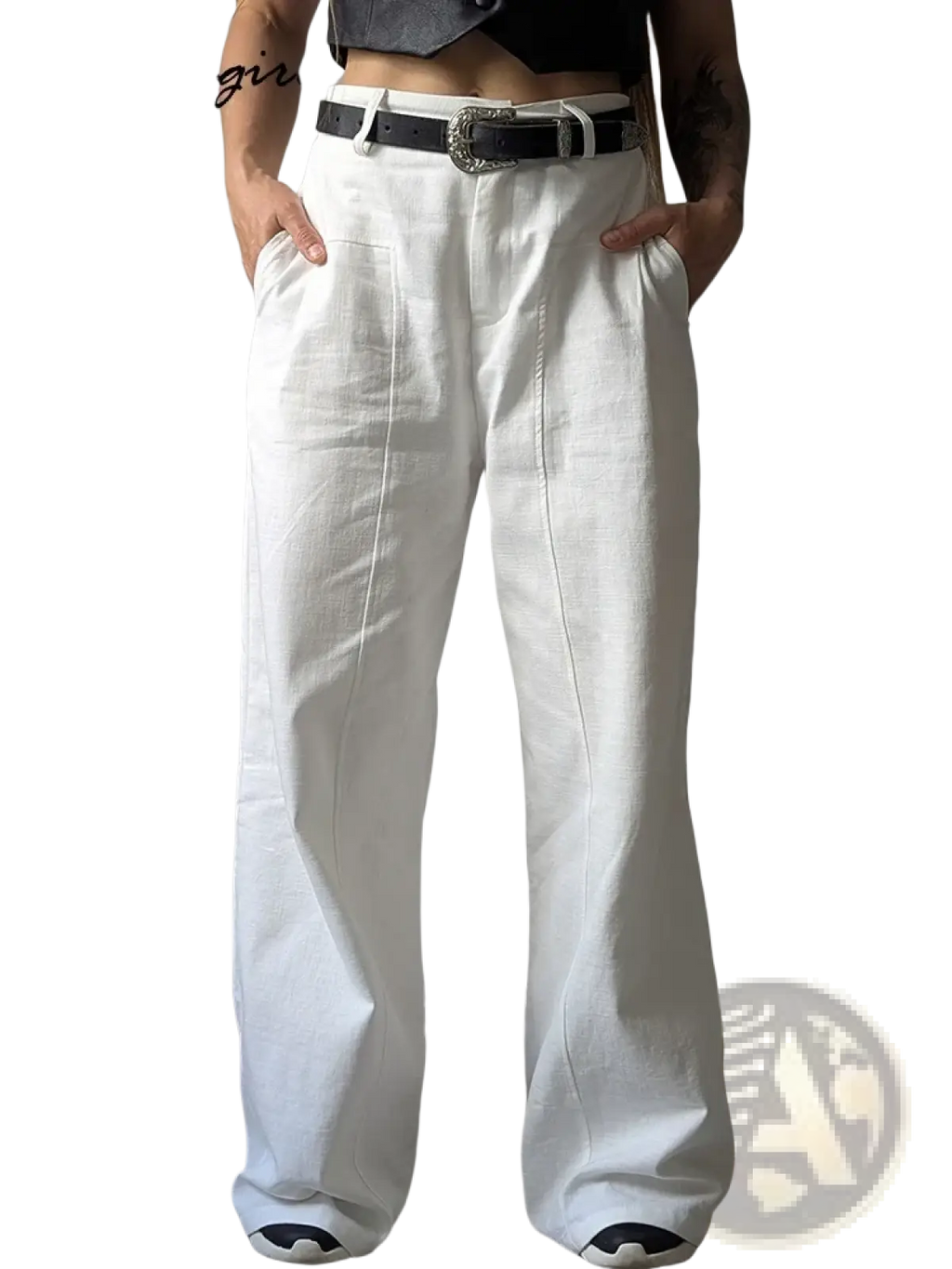 White linen wide leg trousers featuring a relaxed fit with visible stitching details in a soft linen fabric