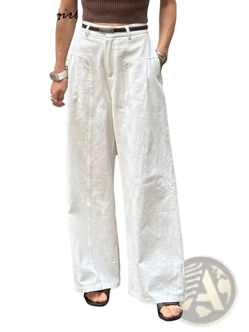 White linen wide leg trousers featuring a relaxed high waisted fit with subtle front pleats