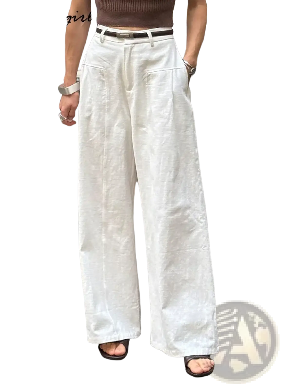 White linen wide leg trousers featuring a relaxed high waisted fit with subtle front pleats
