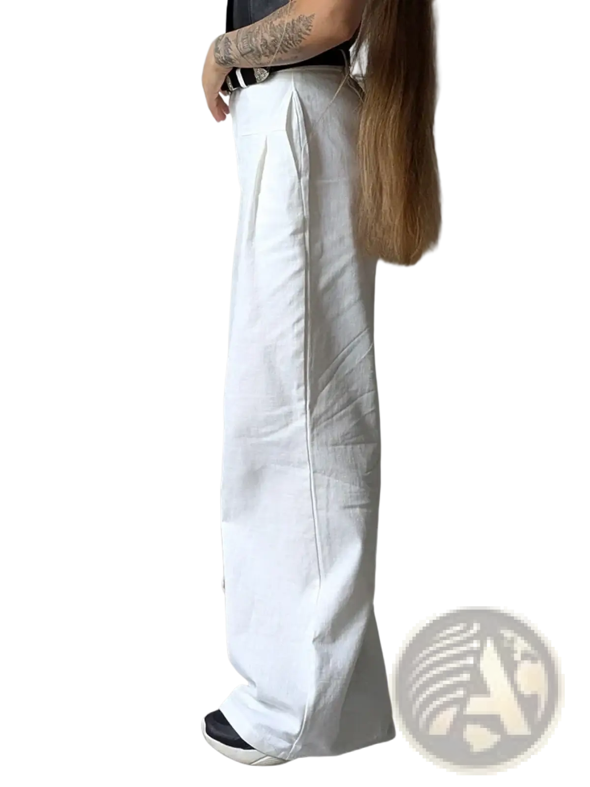 White linen wide leg trousers with a relaxed flowing silhouette and subtle vertical stitching details