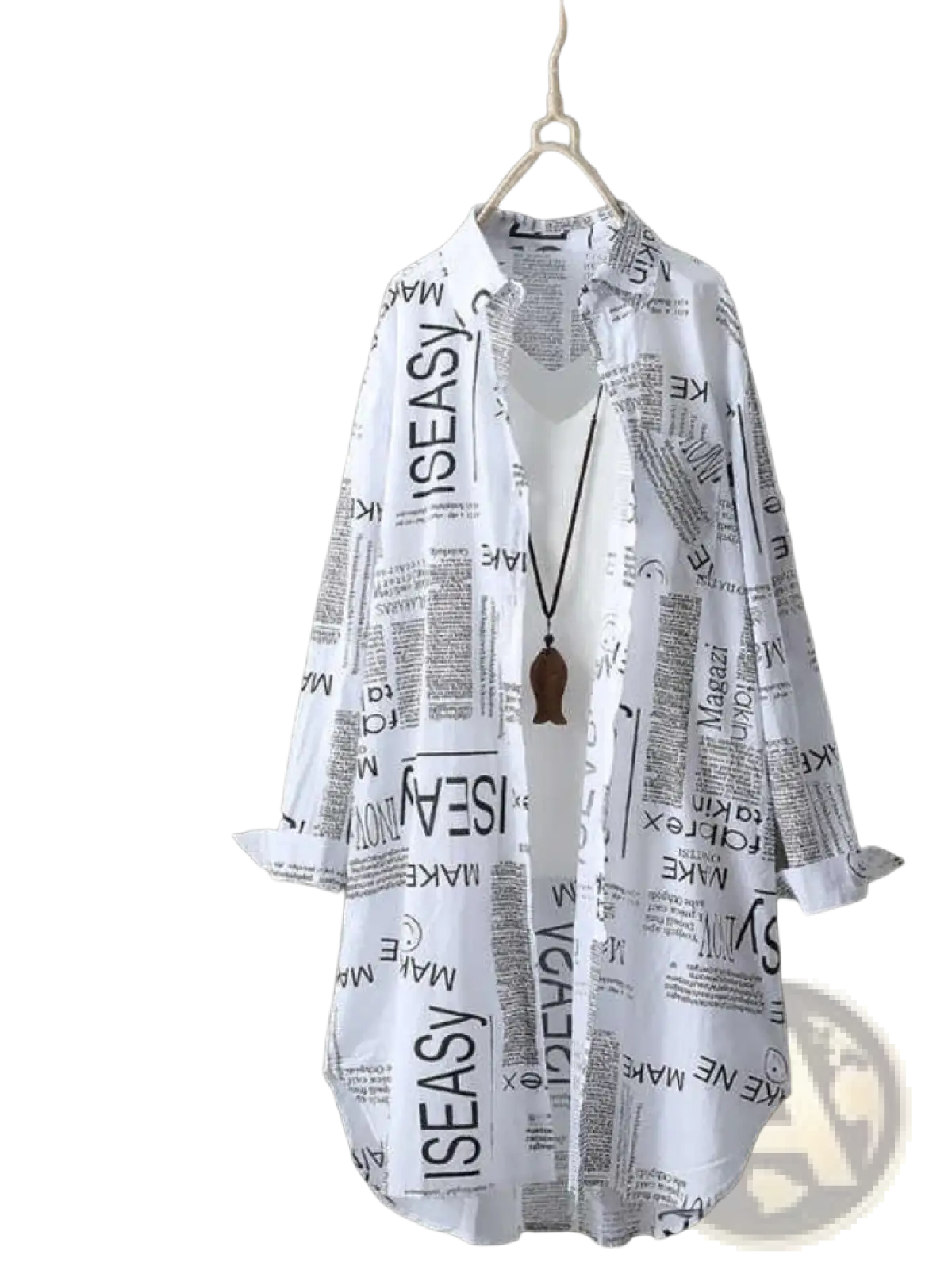White newspaper print linen oversized shirt with black print hanging on wooden hanger