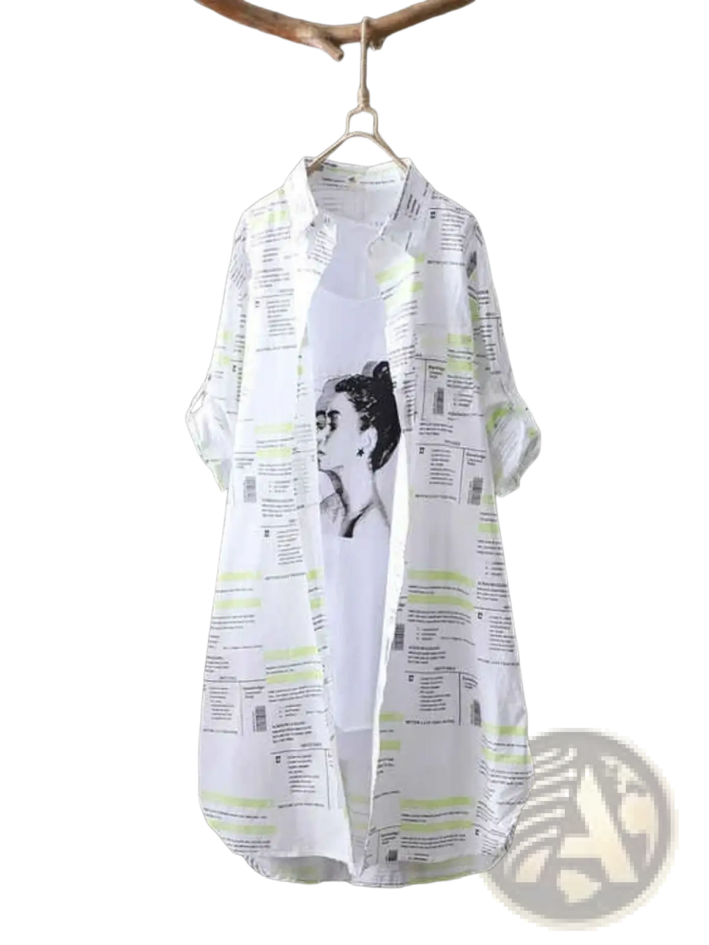 White oversized linen shirt dress with black and lime green newspaper print featuring a portrait of Frida Kahlo