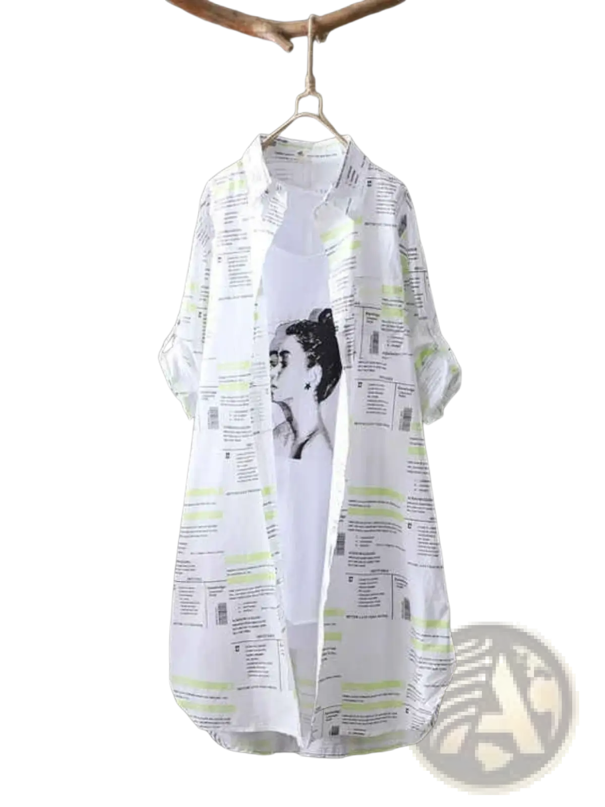 White oversized linen shirt dress with black and lime green newspaper print featuring a portrait of Frida Kahlo