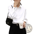 White office blouse long sleeve button down shirt with black buttons and subtle ruching at the cuffs