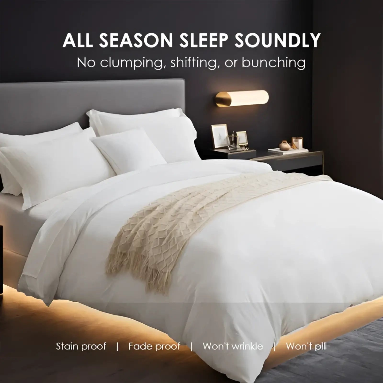 White oversized duvet cover set with pillowcases featuring a textured beige throw blanket draped on the bed