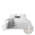 A sleek modern gray upholstered bed headboard with minimalist design paired with a white oversized duvet cover set with pillowcases