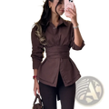 A stylish brown peplum blouse with ruched sleeves and cinched waist in a vintage turn down collar design