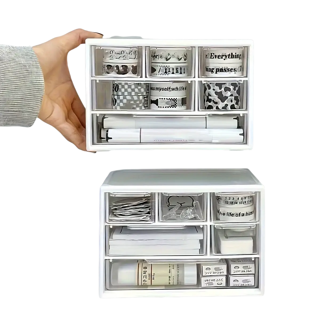 White plastic desk organizer with clear drawers and multiple compartments holding various stationery items